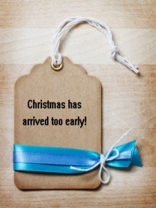 A Christmas gift tag with a message that says "Christmas has arrived too early"